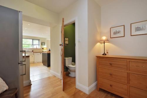 a bathroom with a toilet and a sink at Spacious Free Parking 5 Mins from City Centre in Hereford
