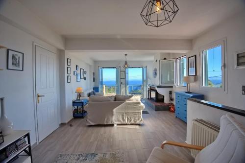 a living room with a couch and a table at Agrielia House in Alonnisos