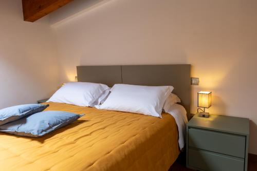a bedroom with a large bed with two pillows at AcquaRoom in Montesilvano Marina