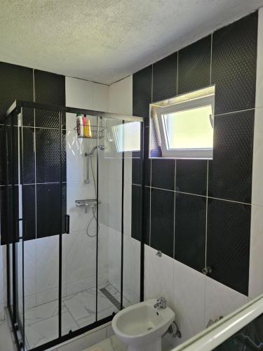 a bathroom with a shower and a toilet at M&M Bazen resort Goražde in Goražde