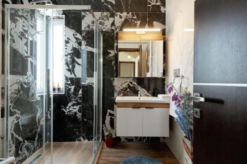 a bathroom with a shower and a sink at Valentina's Luxe Apartment in Mastihari