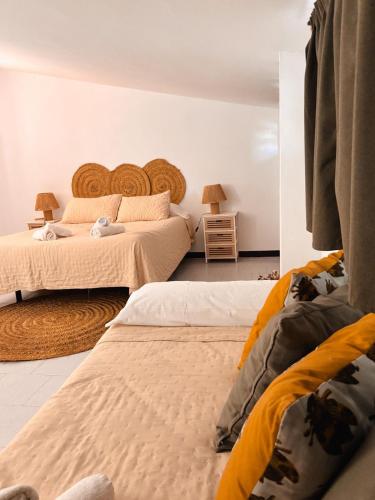 a bedroom with two beds in a room at Casa Almonte in Almonte