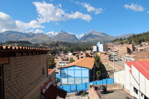 a view of a city with mountains in the background at hotel turistico in Huaraz
