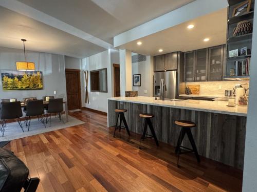 a kitchen with a bar and a dining room at Snowcreek V 883 in Mammoth Lakes