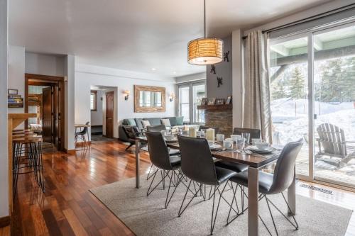 a dining room and living room with a table and chairs at Snowcreek V 883 in Mammoth Lakes