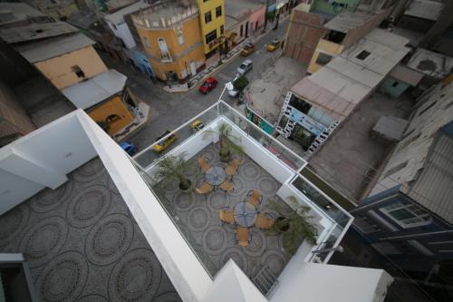 an overhead view of a city with tables and a street at Hostal Florida in Chiclayo