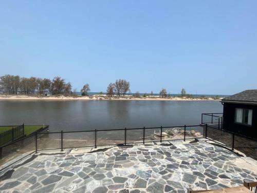 a view of a body of water with a building at Riverside Haven on Georgian Bay in Wasaga Beach