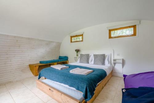 a bedroom with a bed with a blue blanket at 1 Bed in Bude oc-s34856 in Bude