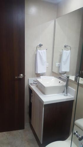 a bathroom with a sink and a mirror at Rivière Boutique Hotel in Medellín