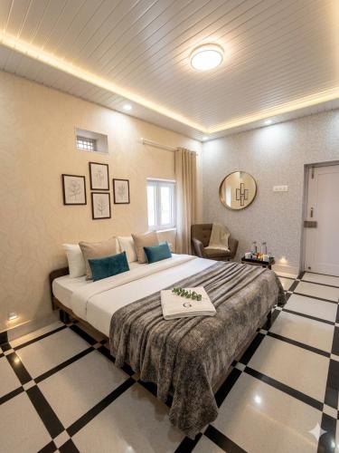 a bedroom with a large bed in a room at Vaishno Atithi Bhawan in Naimishāranya