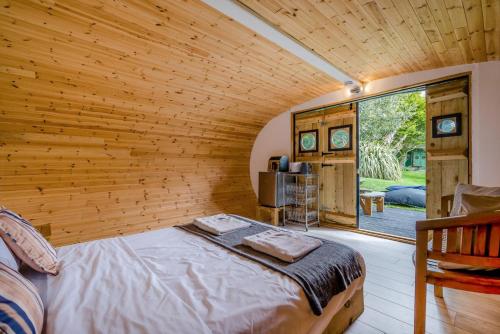 a bedroom with a bed in a room with a window at 1 Bed in Bude oc-s34846 in Bude