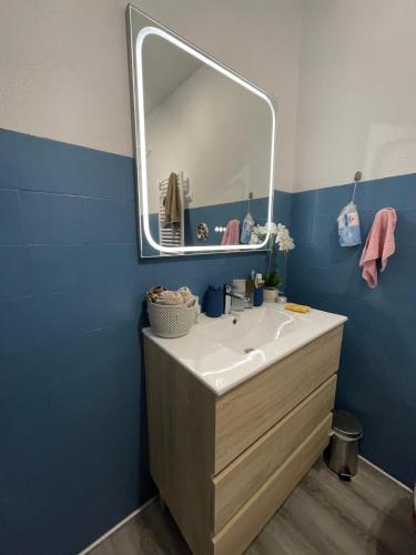 a bathroom with a sink and a mirror at Maison Casa Nord du Portugal Gères in Arcos de Valdevez