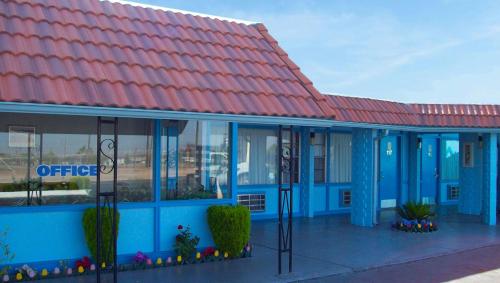 an office building with a red roof at Blue Mist Motel Florence in Florence