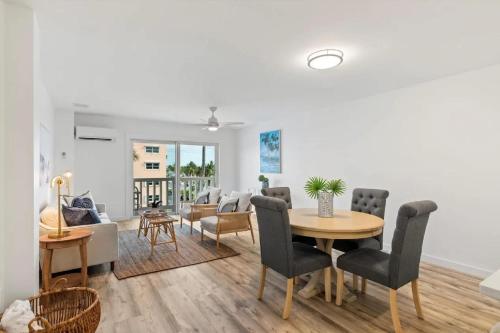 a living room with a table and chairs at Bright 2BR Oceanview Condo in Key West