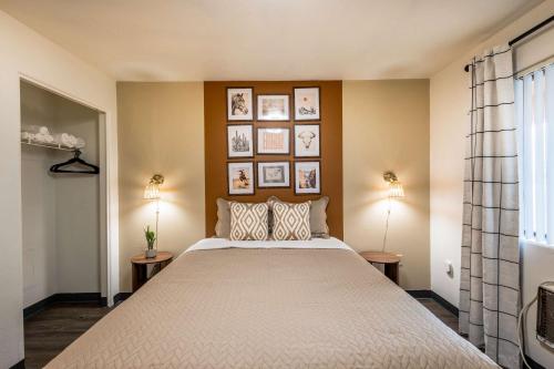 a bedroom with a large bed with two lamps at Chic AZ Studio Travel Nurses Welcome in Cashion