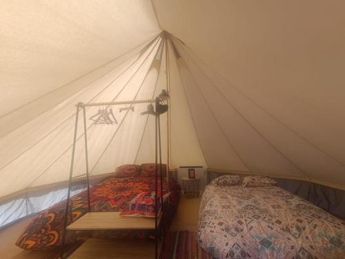 a bedroom with a bed in a tent at El Astial De Ezquerra - Camp in Ezquerra