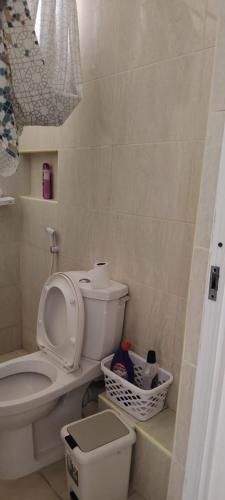 a bathroom with a toilet and a sink at Blossom Homes A2 in Mombasa