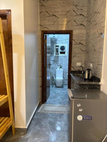 a kitchen with a sink and a toilet in a room at Villa Solla Dahab in Dahab