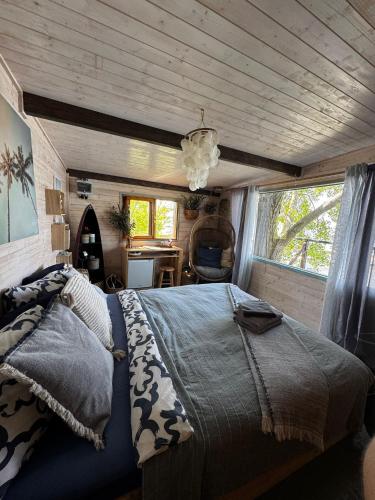 a bedroom with a large bed in a room at The Marina Treehouse in Hamuliakovo