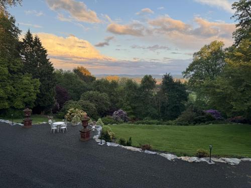 a view of a garden with a table and chairs at Château La Rametière in Le PARC