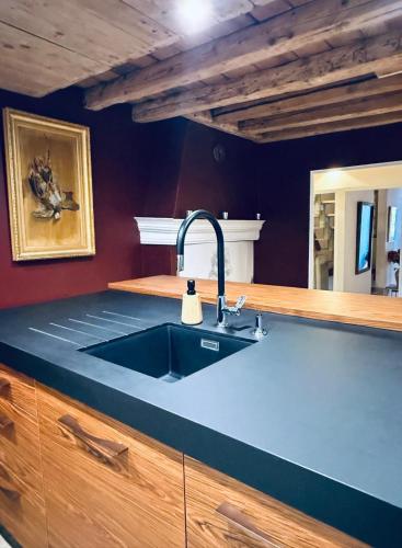 a kitchen with a sink and a counter top at ValTho Orelle Le Paradis Blanc in Orelle