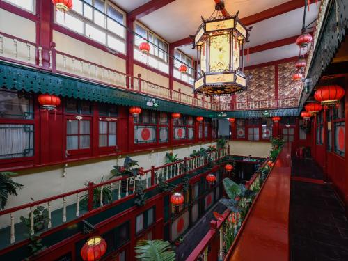 an overhead view of a building with a chandelier at Qianmen Courtyard Hotel in Beijing