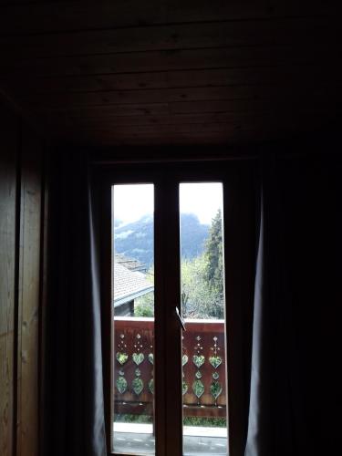 a window with a view of a mountain view at Hotel les Touristes in Verbier