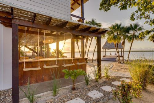 a building with a view of the ocean at Luxury Waterfront 3bd Villa w Pool Dock in Maya Beach