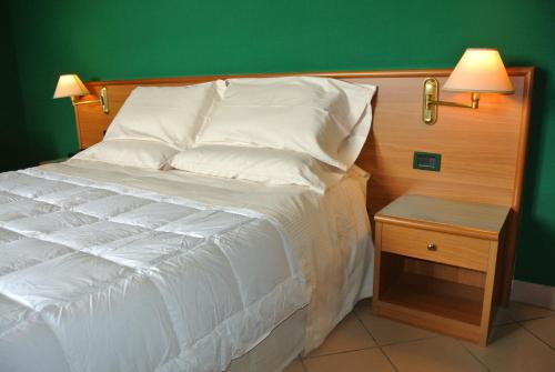 Una cama o camas en una habitación de Modo Hotel