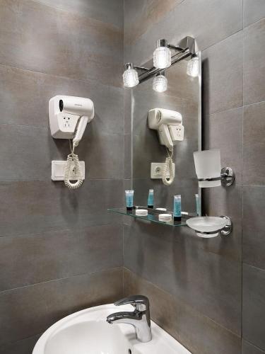 a bathroom with a sink and a mirror at Chill Kobuleti in Kobuleti