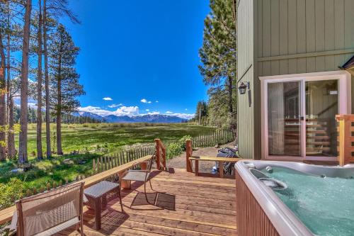 a deck with a hot tub on a house at Tahoe Retreat on the Meadow- Hot Tub AC in South Lake Tahoe