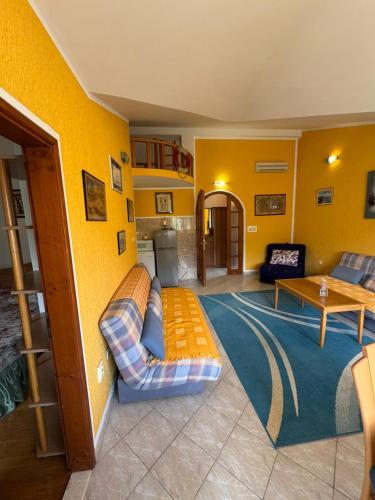 a living room with a couch and a table at Stas Apartments in Đenovići