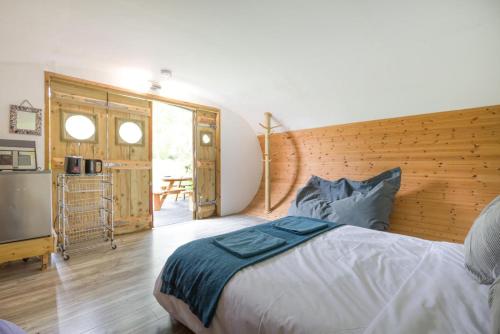 a bedroom with a large bed and a balcony at 1 Bed in Bude oc-s34855 in Bude