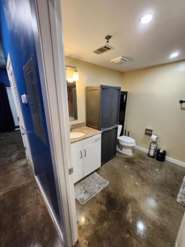 a bathroom with a toilet and a sink at Just like home in Atlanta