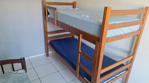 two bunk beds sitting next to each other in a room at Apartamento no Centro Proximo a Tudo in Barra do Garças