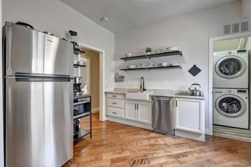 a kitchen with a refrigerator and a washer and dryer at Downtown - Colorado Cool - Relaxing and Quiet in Colorado Springs
