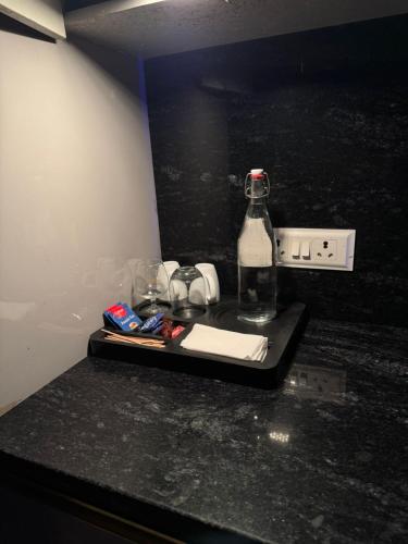 a bottle of soda sitting on top of a counter at Moon Escape Studio in Ghaziabad