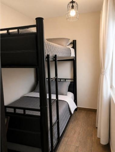 a group of bunk beds in a room at Estancia Familiar cerca de Paseo Durango in Durango