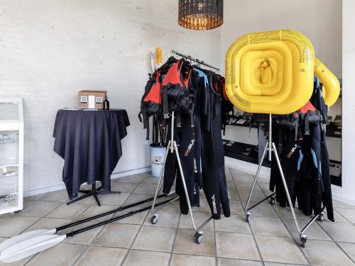 a room with a bunch of clothes on display at Home in Faaborg with sauna in Faaborg
