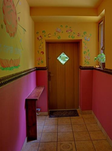 a hallway with a wooden door in a room at Leśny Ogród in Lanckorona