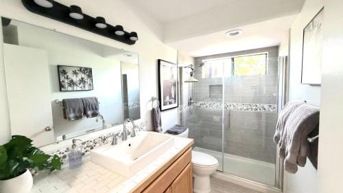 a bathroom with a sink and a shower at Holualoa Gardens 204 in Kailua-Kona