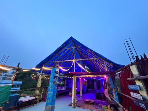 a building with lights on top of it at The Last Stop Backpackers Hostel in Auroville