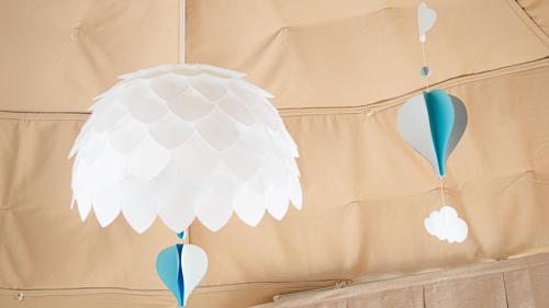 a white pendant light hanging from a wall at yamagata glam in Murayama