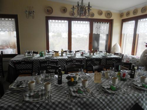 a dining room with a table set up for a meal at Agriturismo Salinola in Ostuni