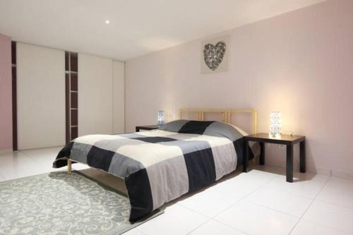 Кровать или кровати в номере La Maison Tourangelle