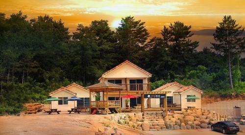a house sitting on top of a hill at Samcheok lime pension in Samcheok