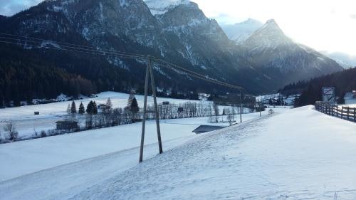 a snow covered slope with a mountain in the background at Katja´s Ferienwohnung in Trins