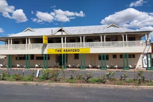 a building with a sign that reads the airstrip at The Ashford Hotel and Restaurent in Ashford