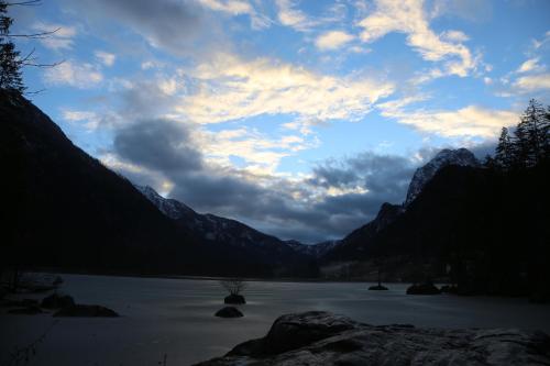 a view of a lake with mountains in the background at Hotel Köppeleck in Schönau am Königssee