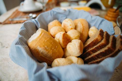 a bowl of bread and toast on a table at La Réserve Suites in Monte Verde
